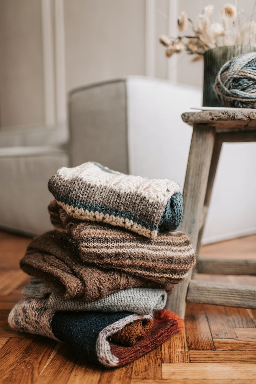 a close up shot of a stack of folded scarves