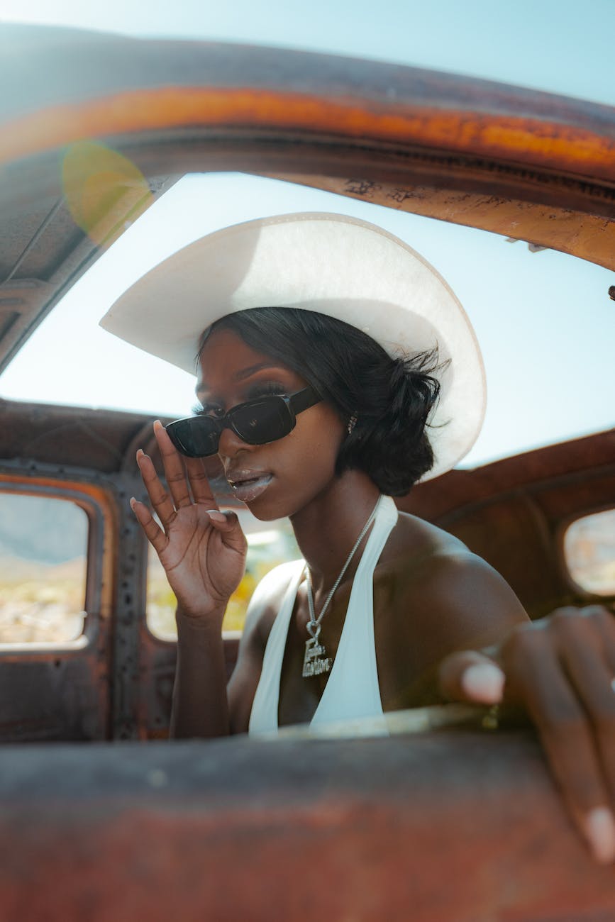 Woman wearing a vintage dress and accessories, exuding timeless style